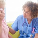 Hospice nurse talking with the family