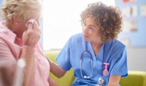 Hospice nurse talking with the family